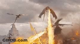 A Group Of Dragons Are Flying Over A Burning Castle . GIF