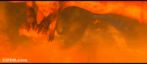 A Group Of Dragons Are Flying Through A Fire Filled Area GIF