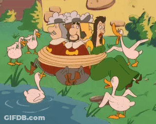 A Group Of Ducks Are Surrounding A Group Of People Tied Up GIF
