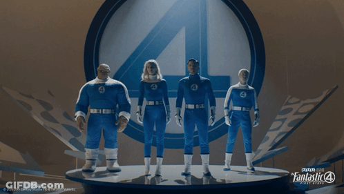 A Group Of Fantastic Four Figures Are Standing On A Stage GIF