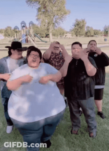 A Group Of Fat People Are Posing For A Picture GIF