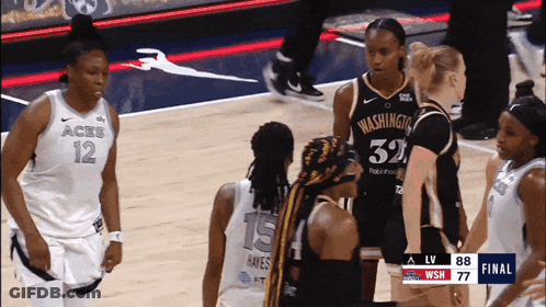 A Group Of Female Basketball Players Are Standing On A Court With One Wearing A Jersey That Says Washington GIF