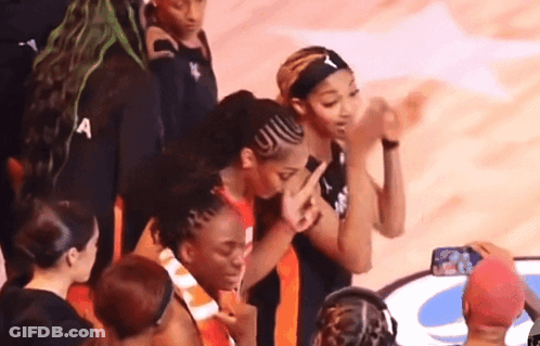 A Group Of Female Basketball Players Including One Wearing A Headband That Says A On It GIF