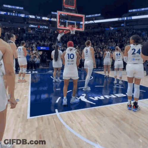 A Group Of Female Basketball Players Standing On A Court With One Wearing The Number 10 GIF