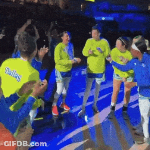 A Group Of Female Basketball Players Wearing Dallas Shirts GIF