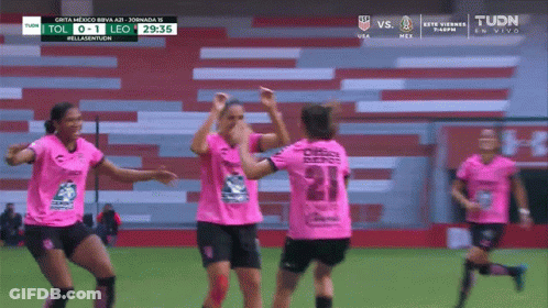 A Group Of Female Soccer Players Are Celebrating A Goal Against Leo GIF