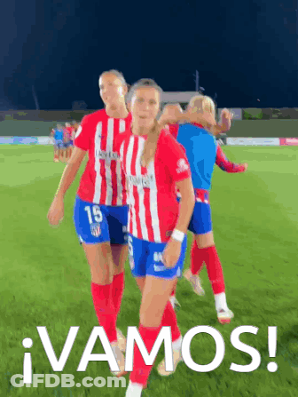 A Group Of Female Soccer Players Are Walking On A Field With The Words Vamos Written On The Bottom GIF