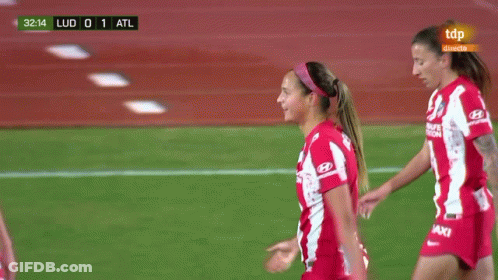 A Group Of Female Soccer Players Wearing Red And White Jerseys With Baxi On Them GIF