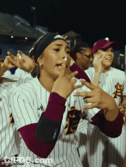A Group Of Female Softball Players Wearing Striped Uniforms With The Letters Fsu On The Front GIF