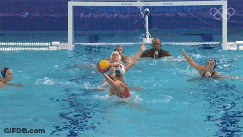 A Group Of Female Water Polo Players Are Playing A Game GIF