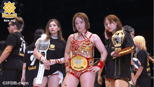 A Group Of Female Wrestlers Standing Next To Each Other With The Hashtag #Pw_mg On The Bottom GIF