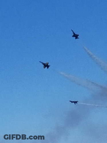 A Group Of Fighter Jets Are Flying In Formation In The Sky GIF