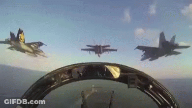 A Group Of Fighter Jets Are Flying In Formation In The Sky GIF