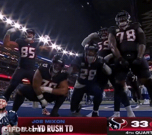 A Group Of Football Players Are Dancing In Front Of A Scoreboard That Says 1 Yd Rush Td GIF
