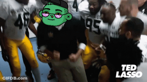 A Group Of Football Players Are Gathered In A Locker Room With Ted Lasso Written In The Corner GIF