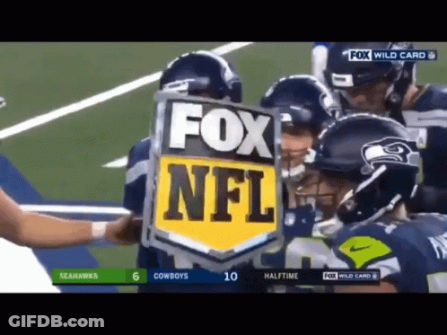A Group Of Football Players Are Holding A Fox Nfl Shield GIF