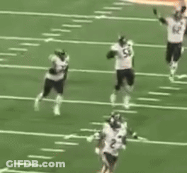 A Group Of Football Players Are On A Field With One Wearing Number 82 GIF