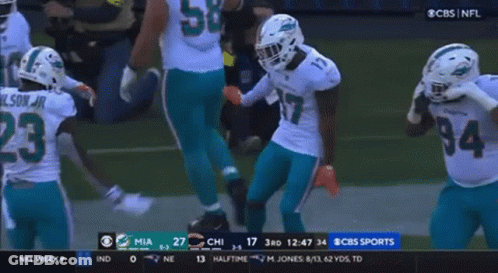 A Group Of Football Players Are On A Field With The Number 23 On Their Jersey GIF