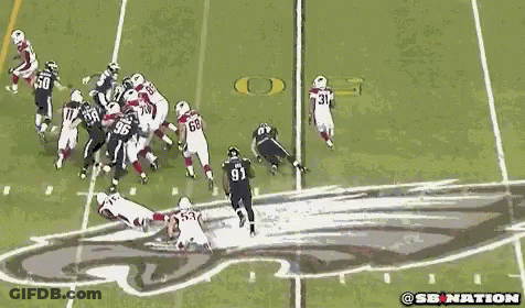 A Group Of Football Players Are Playing A Game On A Field And One Of The Players Has The Number 96 On His Jersey GIF