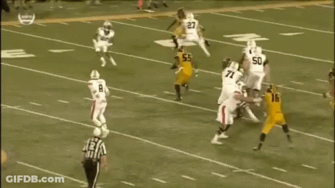 A Group Of Football Players Are Playing A Game On A Field . One Of The Players Has The Number 78 On His Jersey . GIF
