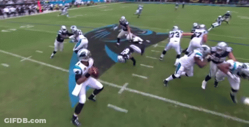 A Group Of Football Players Are Playing A Game On A Field With A Panthers Logo In The Background . GIF