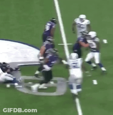 A Group Of Football Players Are Running On A Field With The Number 28 On Their Jersey GIF
