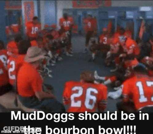 A Group Of Football Players Are Sitting In A Circle In A Locker Room And One Of Them Has The Number 26 On His Jersey GIF