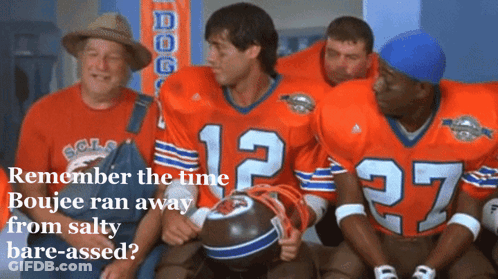 A Group Of Football Players Are Sitting In A Locker Room And One Of Them Has The Number 12 On Their Jersey GIF