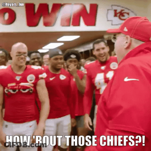 A Group Of Football Players Are Standing In Front Of A Sign That Says Win GIF