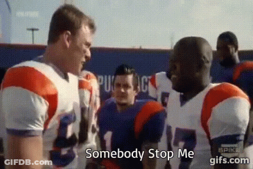 A Group Of Football Players Are Standing Next To Each Other And One Of Them Is Talking To The Other . GIF