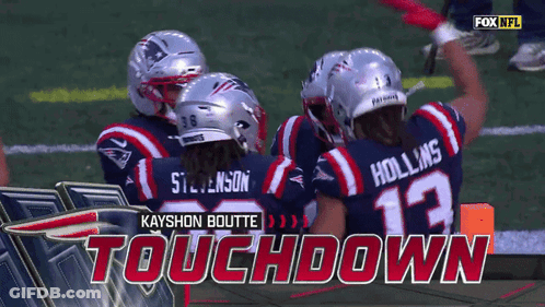 A Group Of Football Players Celebrate A Touchdown GIF