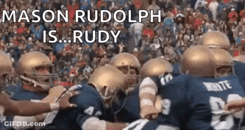 A Group Of Football Players Huddled Together With The Words Mason Rudolph Is Rudy Written Above Them GIF