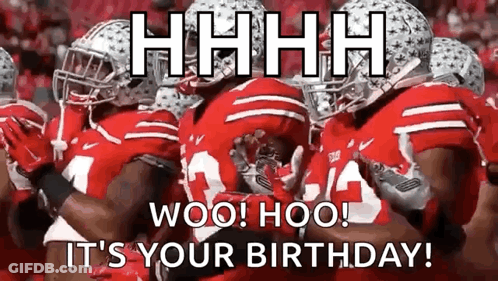 A Group Of Football Players In Red Uniforms Are Standing Next To Each Other On The Field . GIF