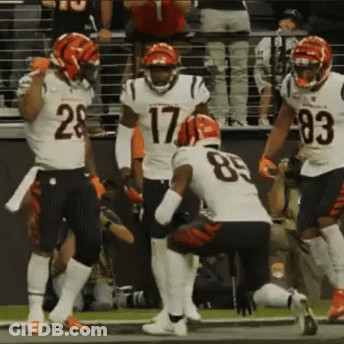 A Group Of Football Players Including Number 17 And 83 GIF