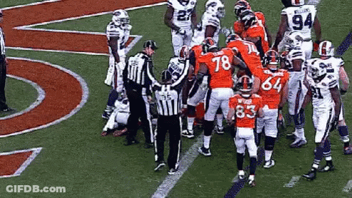 A Group Of Football Players On A Field With One Wearing The Number 83 GIF