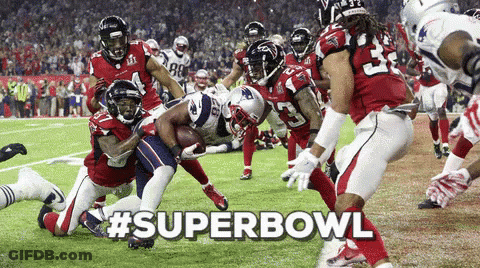 A Group Of Football Players On A Field With #Superbowl Written In The Upper Right Corner GIF