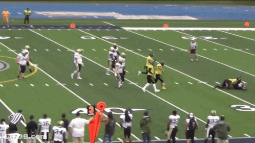 A Group Of Football Players On A Field With The Number 30 On It GIF