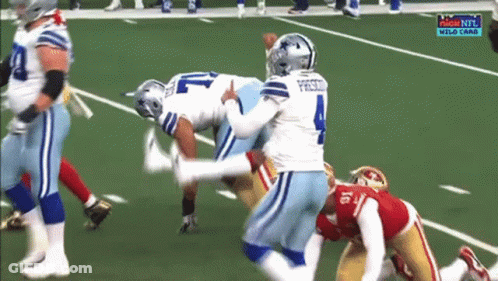 A Group Of Football Players On A Field With The Number 4 On The Jersey GIF