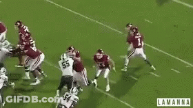 A Group Of Football Players On A Field With The Word Lamanna On The Bottom Right GIF