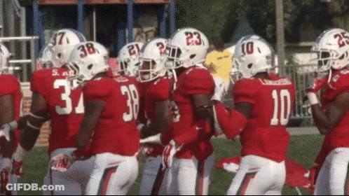 A Group Of Football Players One Of Whom Has The Number 10 GIF