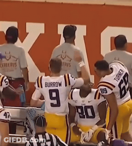 A Group Of Football Players One Of Whom Is Wearing A Number 9 Jersey GIF