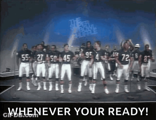A Group Of Football Players Standing On A Stage With The Words " Whenever Your Ready " Written On The Bottom GIF
