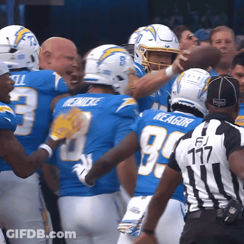 A Group Of Football Players With One Wearing The Number 3 On His Jersey GIF