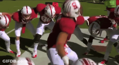 A Group Of Football Players With One Wearing The Number 86 On Their Jersey GIF