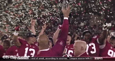 A Group Of Football Players With The Number 13 On Their Jerseys Are Celebrating GIF
