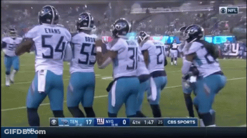 A Group Of Football Players With The Number 54 On The Back GIF