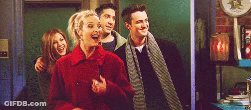A Group Of Friends Are Standing Next To Each Other And Laughing . GIF