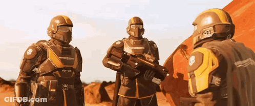 A Group Of Futuristic Soldiers Are Standing Next To Each Other On A Red Planet . GIF