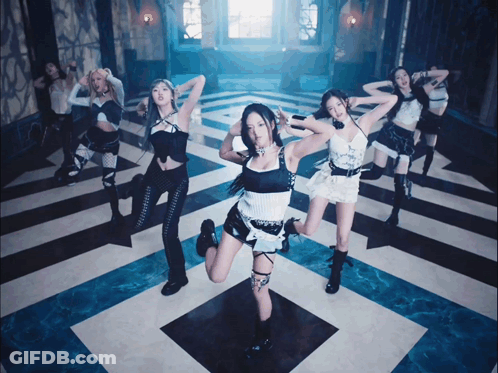 A Group Of Girls Are Dancing On A Checkered Floor GIF