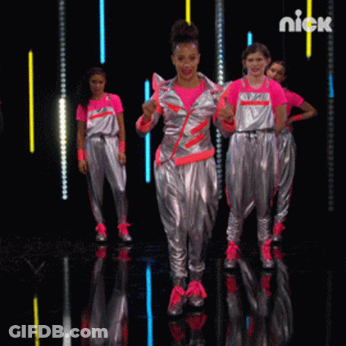 A Group Of Girls Are Dancing On A Stage And The Word Nick Is On The Bottom GIF
